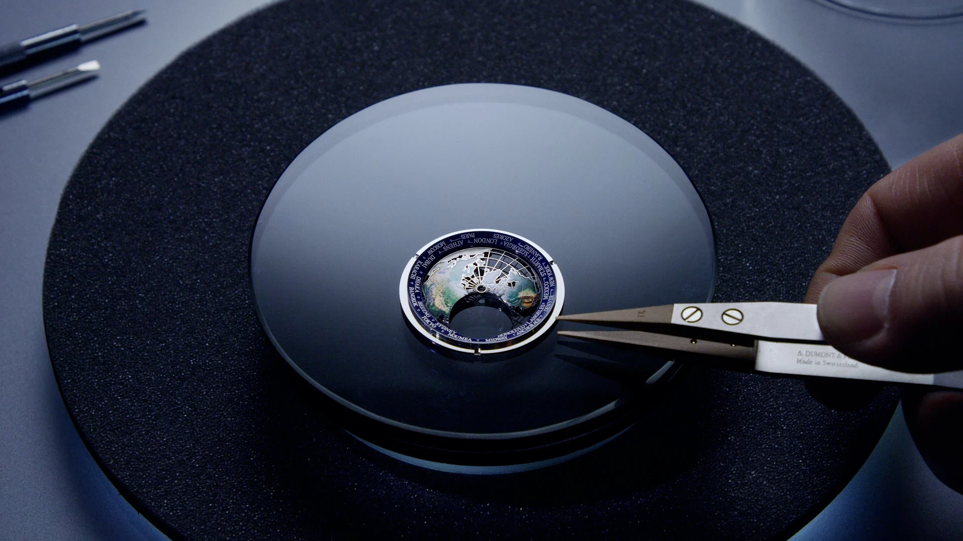 watchmaker assembling a watch