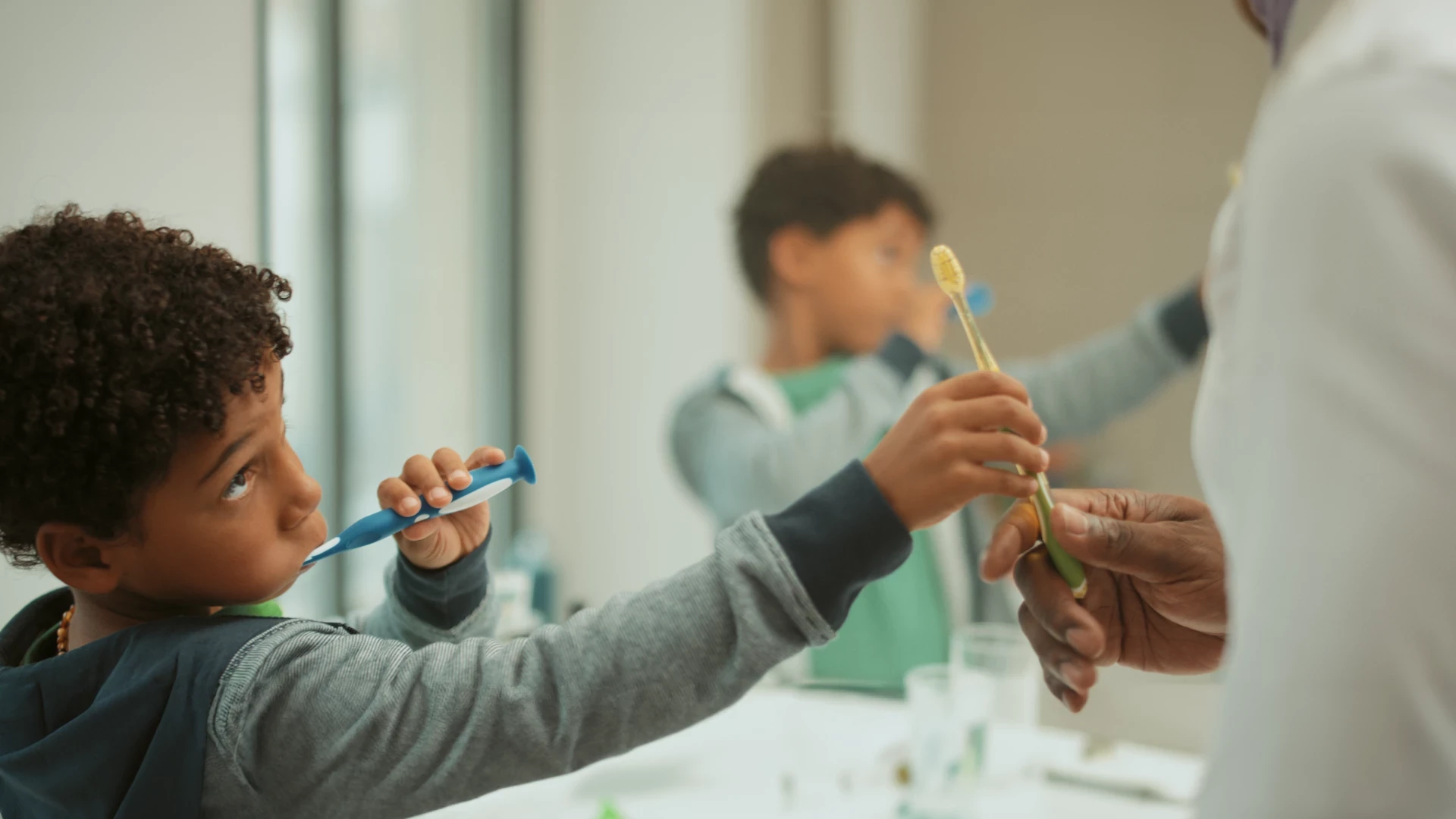Child brushing his teeth