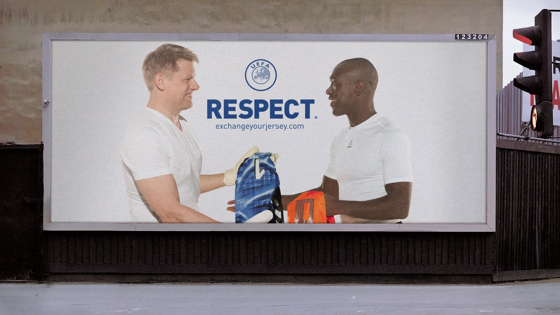 2 ambassadors exchanging their jerseys in sign of respect.
